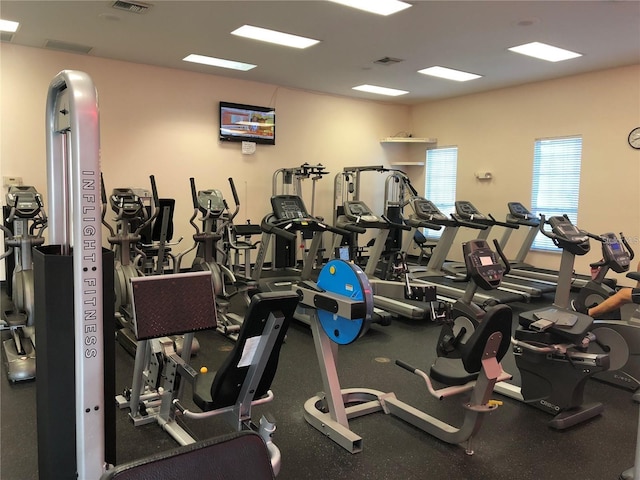 exercise room featuring visible vents