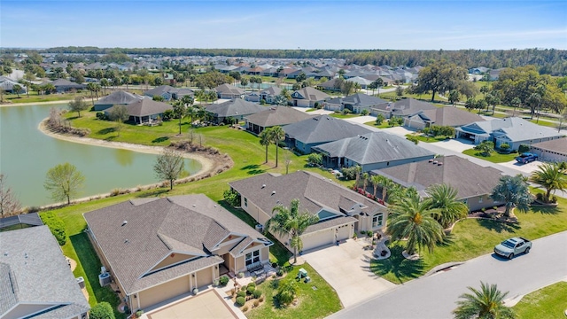 birds eye view of property featuring a residential view and a water view