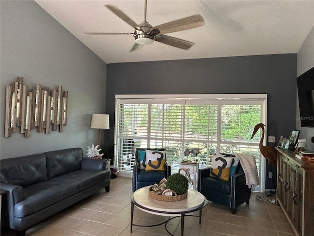 tiled living area featuring lofted ceiling and a ceiling fan