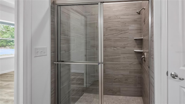 full bath featuring a shower stall