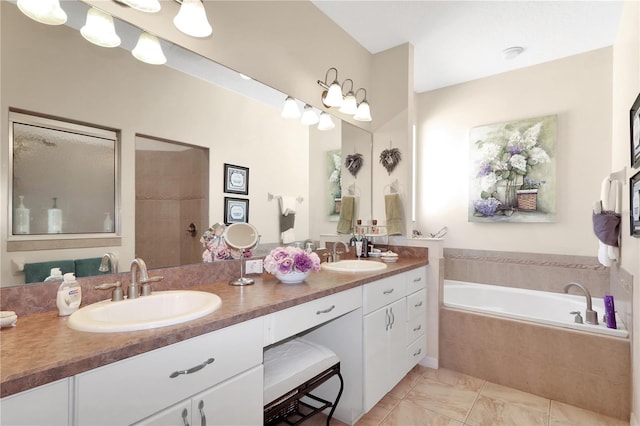 full bathroom with a garden tub, tiled shower, double vanity, and a sink