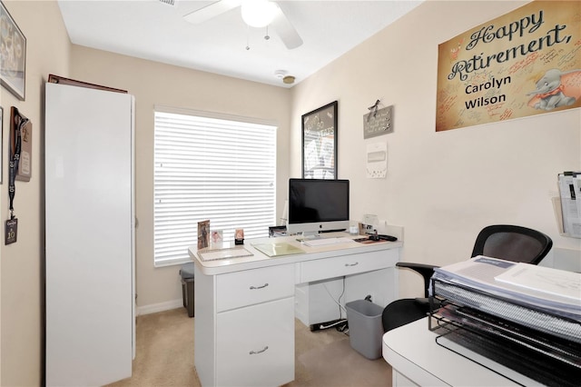 office area featuring light carpet and a ceiling fan