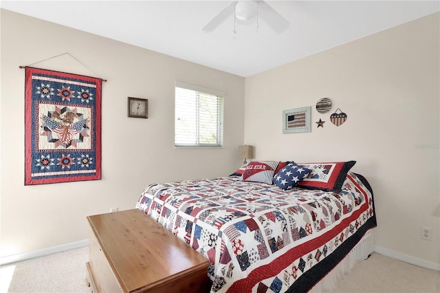 carpeted bedroom with baseboards and a ceiling fan