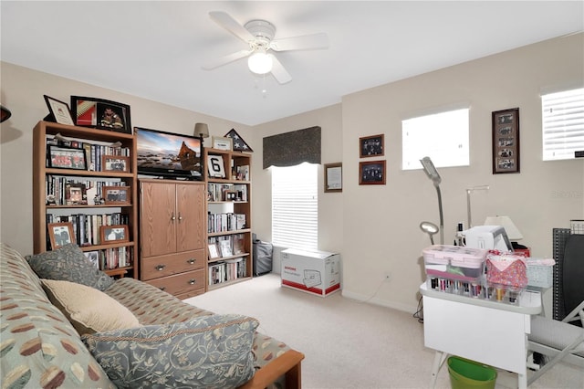 interior space featuring carpet flooring and a ceiling fan