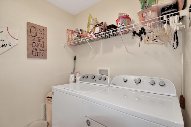 clothes washing area with laundry area and washer and dryer