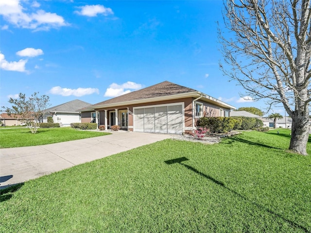 ranch-style home featuring a front yard, concrete driveway, and an attached garage