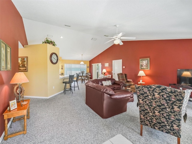 living area featuring visible vents, a ceiling fan, carpet, baseboards, and vaulted ceiling