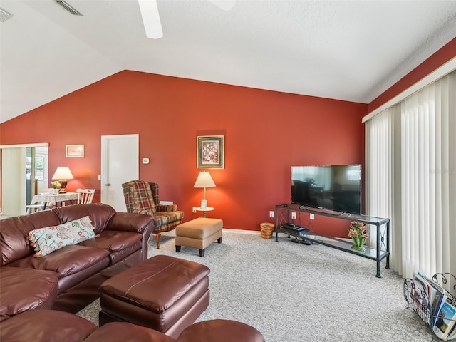 living room featuring lofted ceiling, baseboards, visible vents, and carpet floors