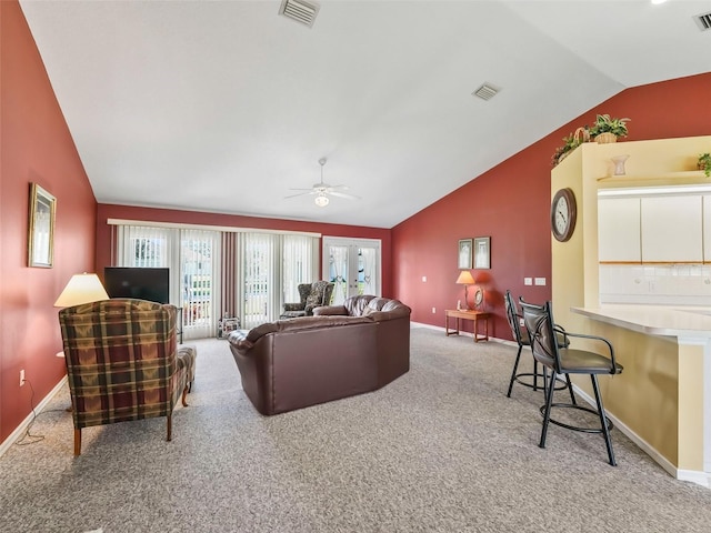 living room featuring visible vents, carpet flooring, a ceiling fan, and lofted ceiling