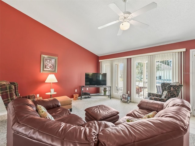 living area with carpet flooring, a textured ceiling, a ceiling fan, and lofted ceiling