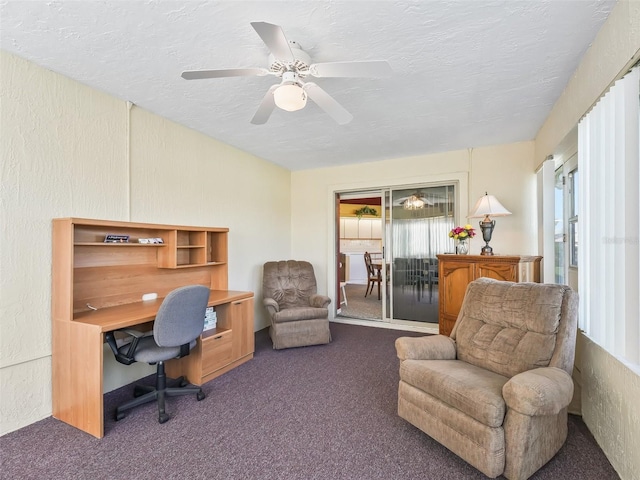 office area featuring ceiling fan, carpet flooring, a textured wall, and a textured ceiling