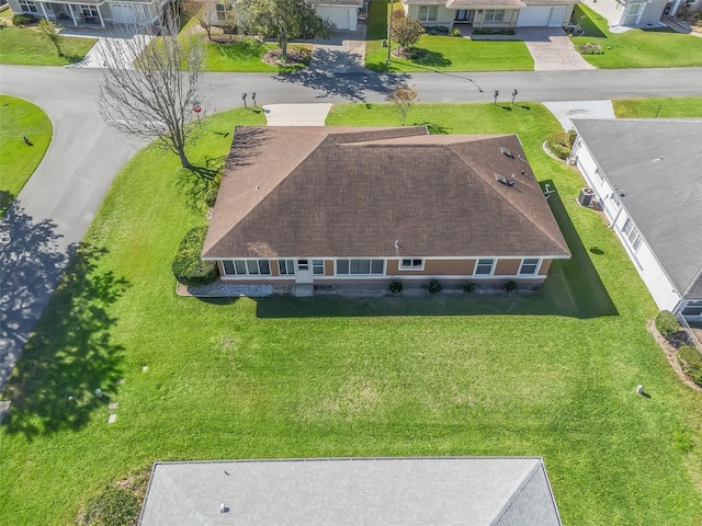 birds eye view of property with a residential view