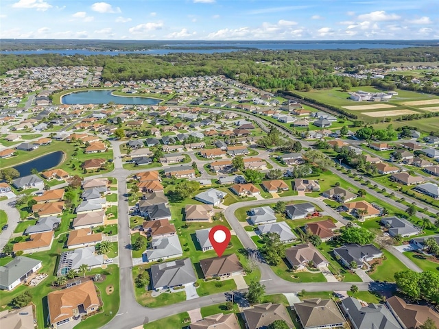 aerial view with a water view and a residential view