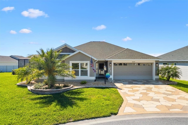 ranch-style house with stucco siding, a front lawn, roof with shingles, concrete driveway, and a garage