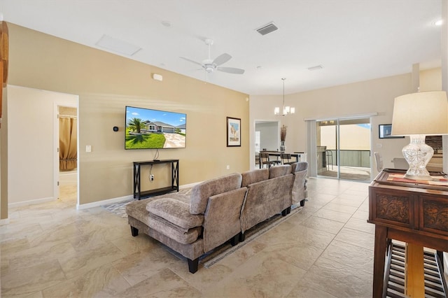 living area with visible vents, ceiling fan with notable chandelier, marble finish floor, and baseboards