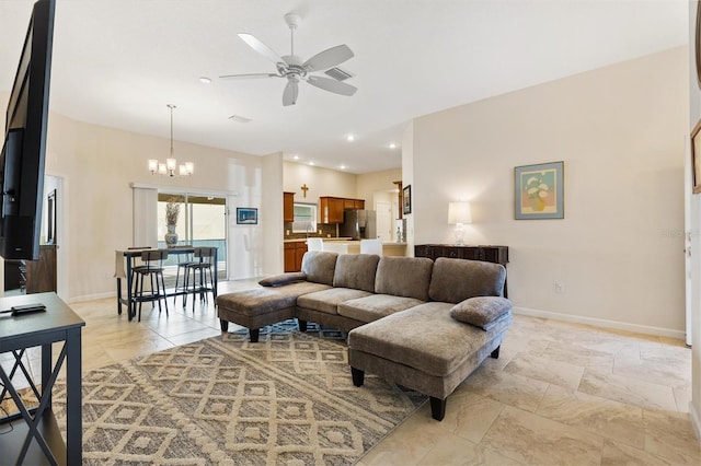 living area with recessed lighting, visible vents, baseboards, and ceiling fan with notable chandelier