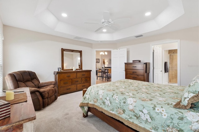 bedroom with a raised ceiling, recessed lighting, carpet, and visible vents