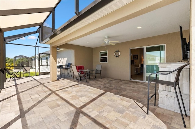 sunroom / solarium with ceiling fan