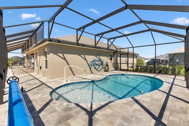 pool featuring a lanai and a patio