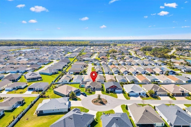 birds eye view of property with a residential view