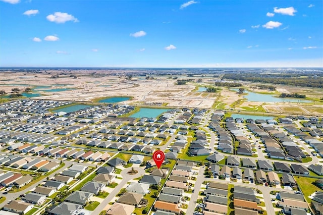 aerial view with a residential view and a water view