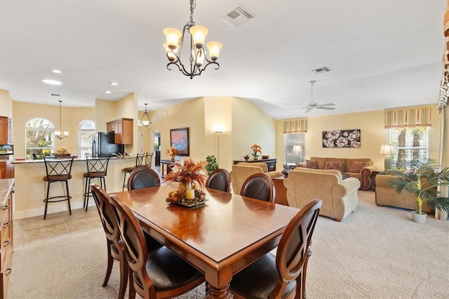 dining space with recessed lighting, visible vents, light colored carpet, and ceiling fan with notable chandelier