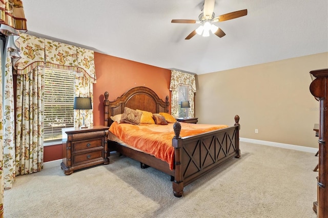 bedroom with carpet flooring, ceiling fan, lofted ceiling, and baseboards