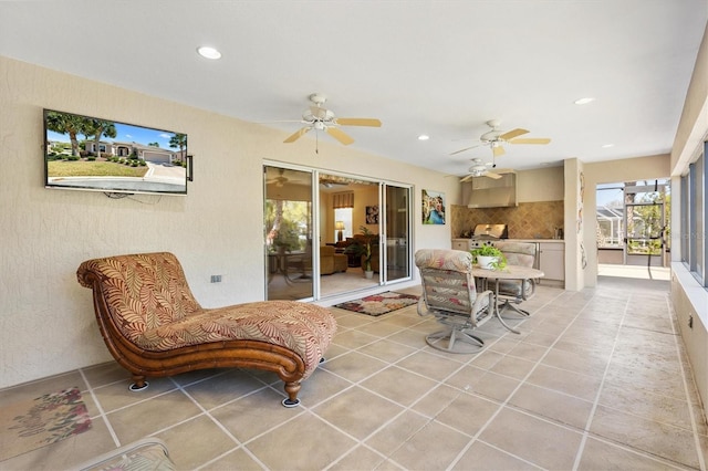 view of patio / terrace with glass enclosure and a ceiling fan