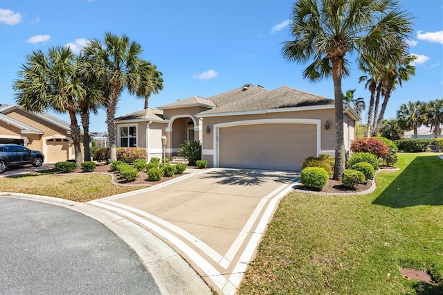 view of front of house featuring stucco siding, an attached garage, concrete driveway, and a front lawn