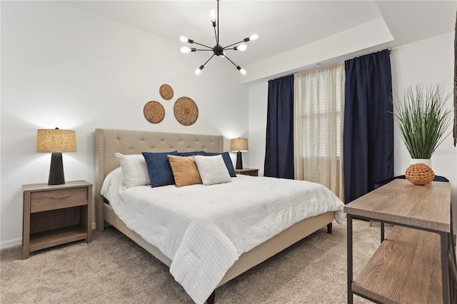 bedroom featuring a notable chandelier and light colored carpet