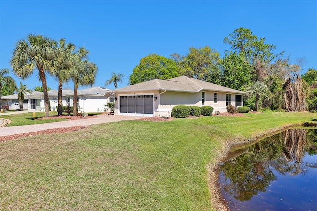 view of front of house featuring a front yard, decorative driveway, a garage, and stucco siding