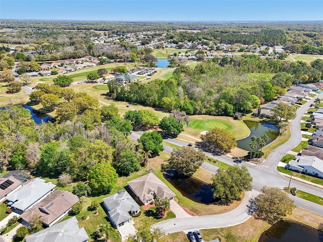 aerial view with a residential view, a water view, and view of golf course