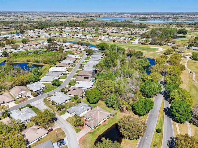 aerial view with a water view and a residential view