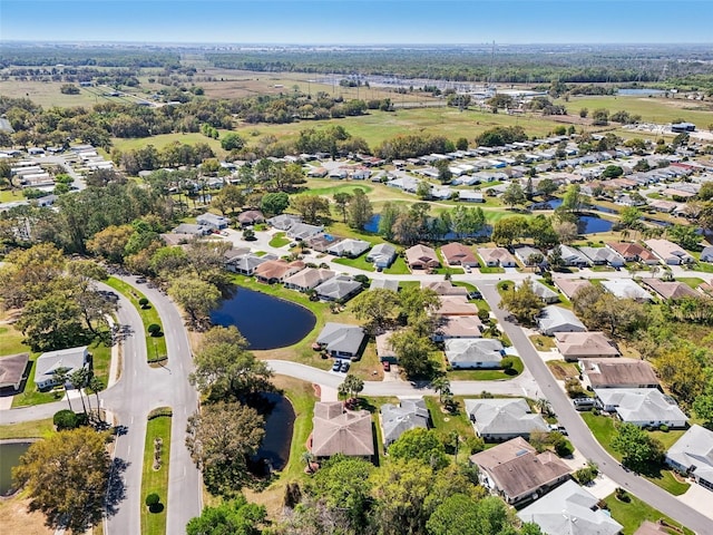 birds eye view of property featuring a residential view and a water view