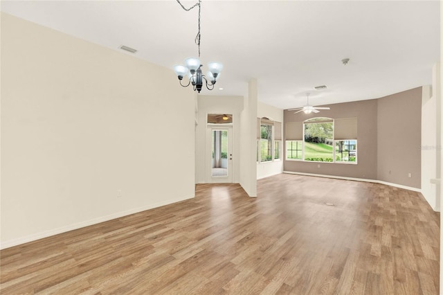 empty room featuring visible vents, baseboards, light wood-style flooring, and ceiling fan with notable chandelier