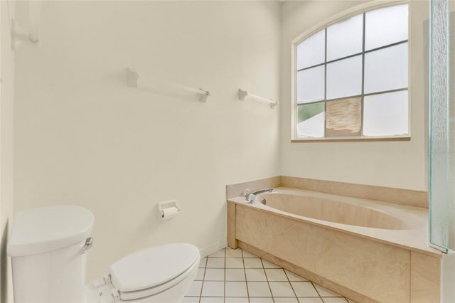 full bathroom with tile patterned floors, toilet, a bath, and baseboards