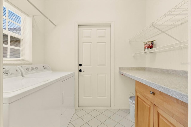 laundry room with light tile patterned floors, laundry area, and washer and dryer