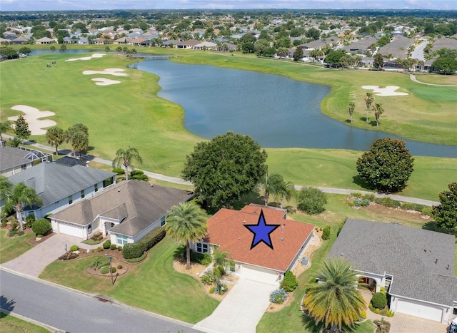 bird's eye view featuring a residential view, golf course view, and a water view