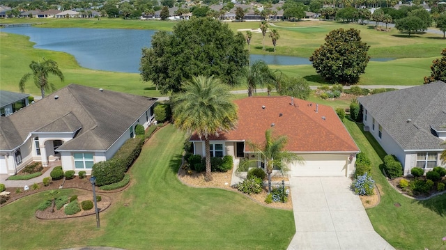 aerial view featuring a water view and view of golf course