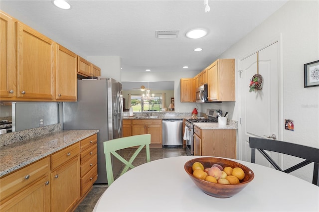 kitchen featuring recessed lighting, visible vents, appliances with stainless steel finishes, and a sink