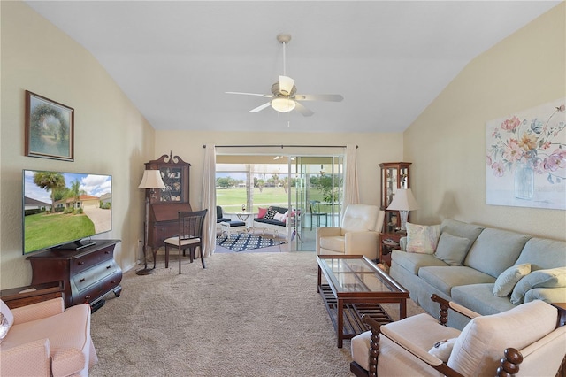 living area featuring carpet flooring, ceiling fan, and lofted ceiling