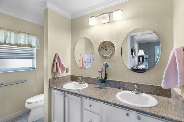 full bathroom featuring crown molding, toilet, double vanity, and a sink