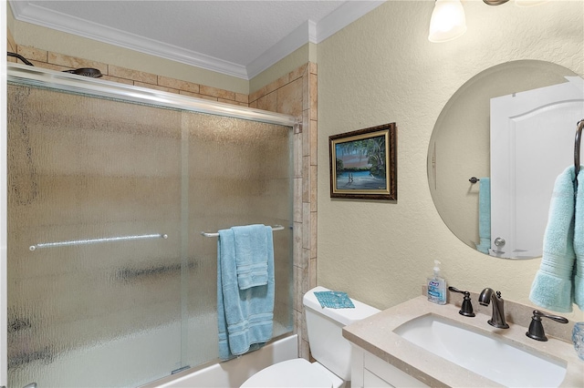 full bathroom featuring toilet, ornamental molding, bath / shower combo with glass door, vanity, and a textured wall