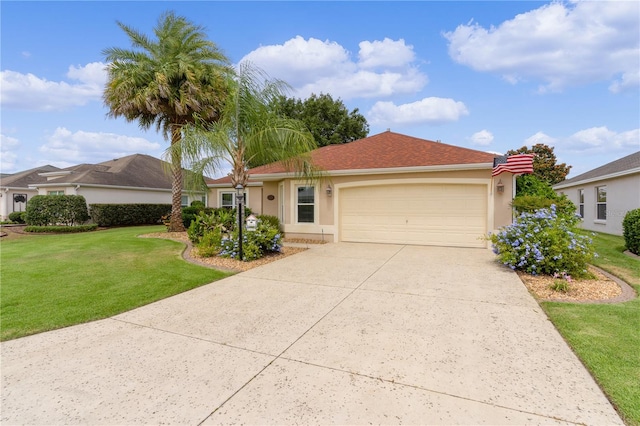 ranch-style house featuring a garage, stucco siding, driveway, and a front yard