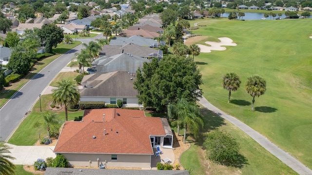 aerial view featuring view of golf course, a water view, and a residential view