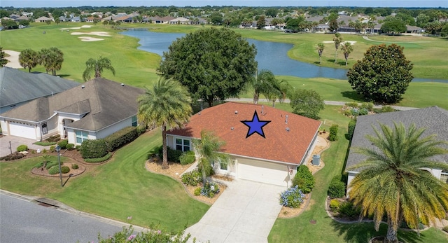 aerial view featuring golf course view, a water view, and a residential view