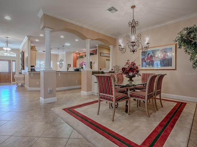 dining space featuring visible vents, crown molding, baseboards, decorative columns, and light tile patterned floors