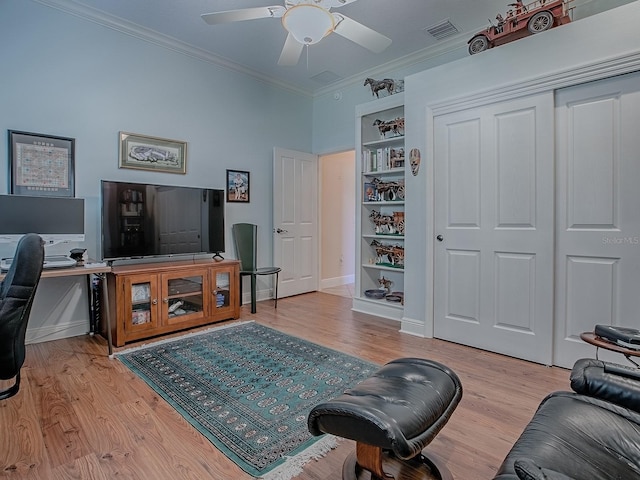 interior space featuring visible vents, light wood-style flooring, and crown molding