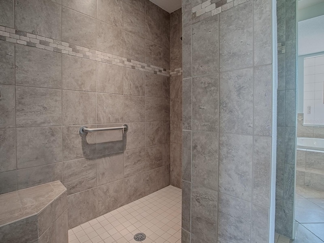 full bath with tiled shower