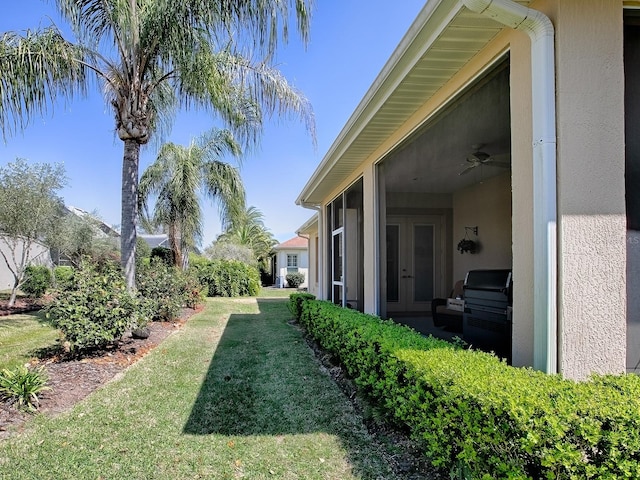 view of yard with french doors